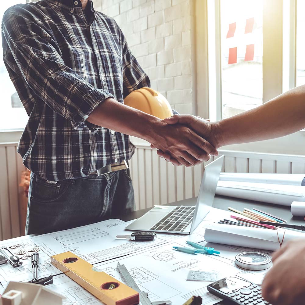 Home New | membership construction workers shake hands | Associated Builders & Contractors